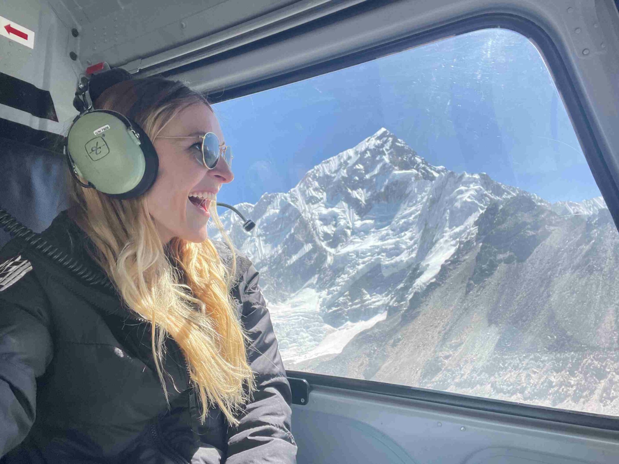 EBC traveler enjoying helicopter return