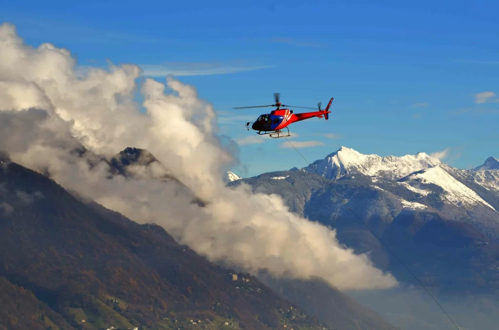 Aerial view through the helicopter window showing Himalayan peaks, passengers wearing headsets enjoying scenic flight, immersive perspective.