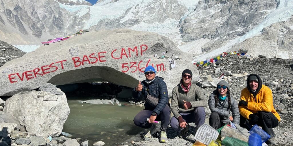 climbers basking in the joy of reaching everest base camp