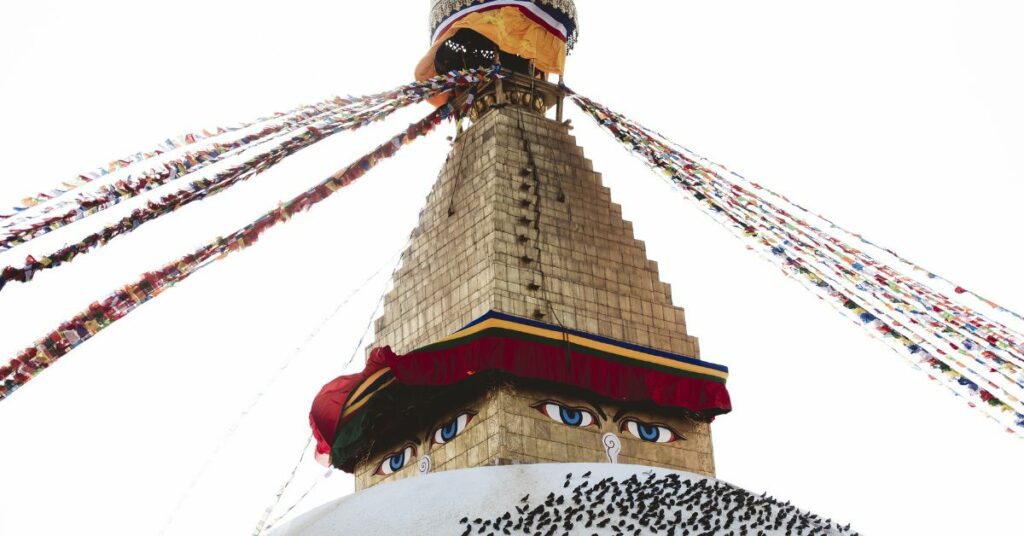the iconic swayambhunath stupa with its white dome, golden spire, and buddha eyes