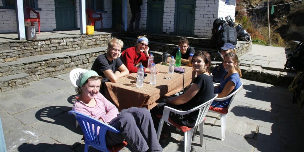 trekking team resting on journey from bamboo to abc