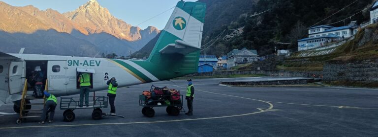 Plane boarding with mountain view at Lukla Airport
