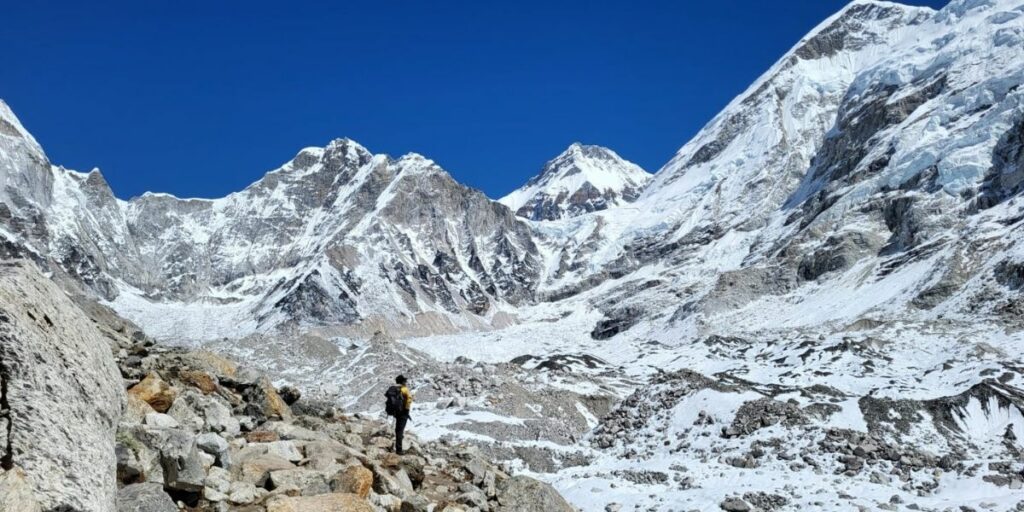 Trekker approaches snowy Everest Base Camp with all essential gears