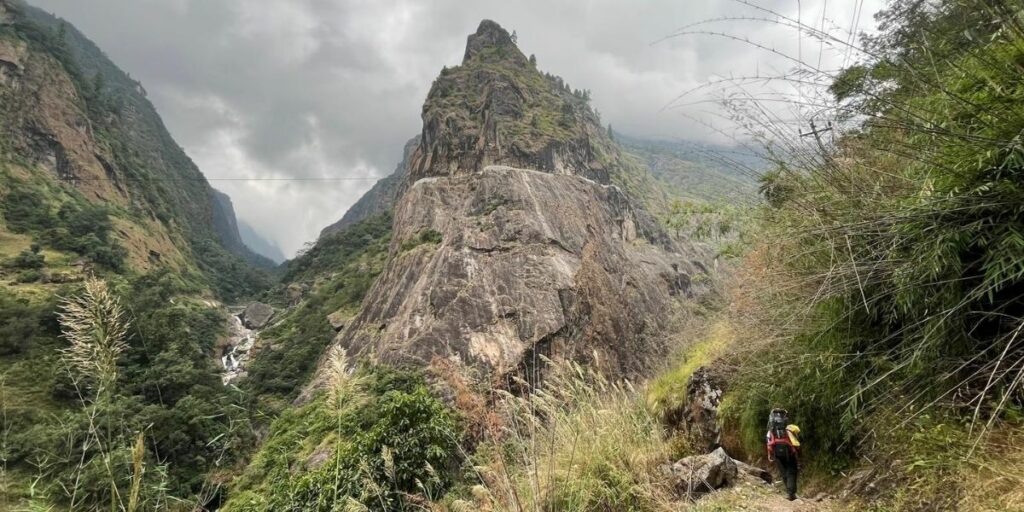 Trekker enjoying clear skies and vibrant trails on the best time of the Annapurna trek