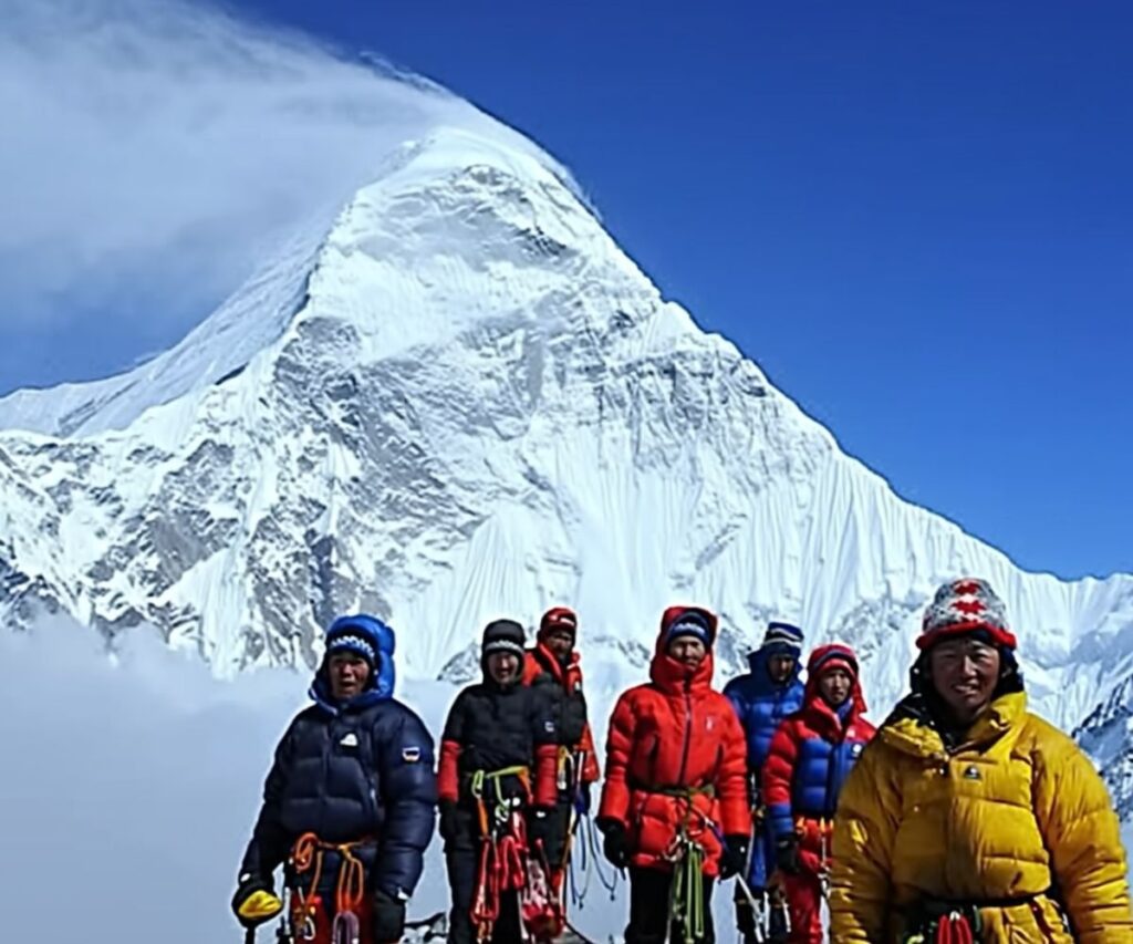 A group of mountaineers preparing for Everest summit with ropes and gear