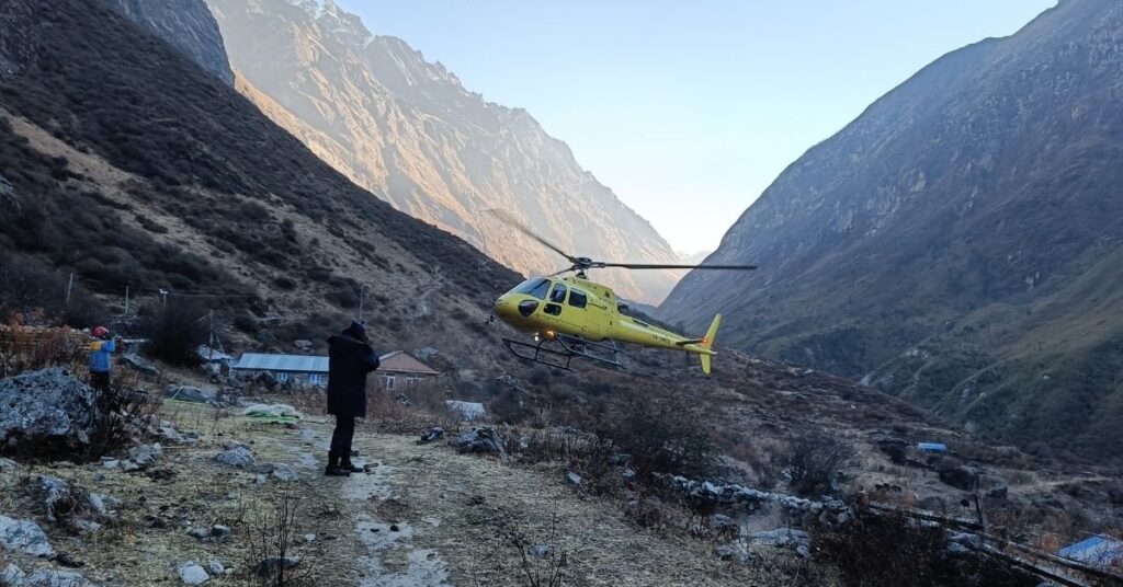 Chopper hovering near Langtang Himalayan ridge