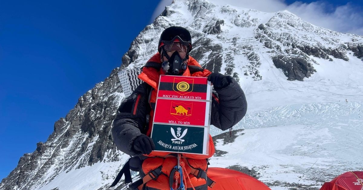 Mountain climber with team sign during Everest expedition