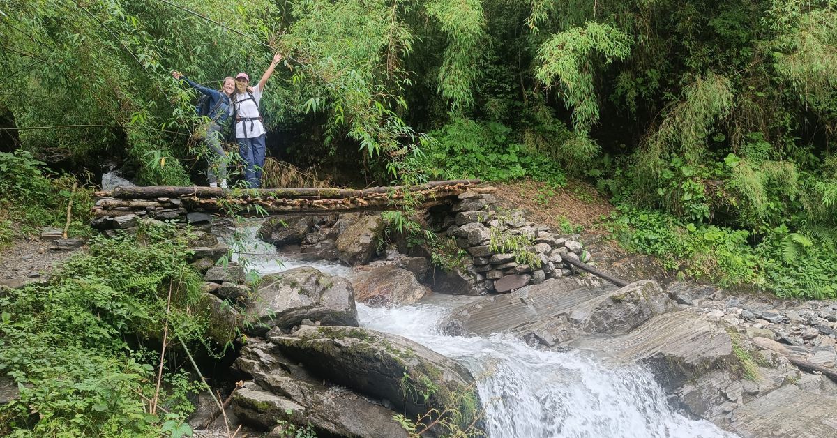 Two friends posing on trail from Sinwa to Deurali, Day 2