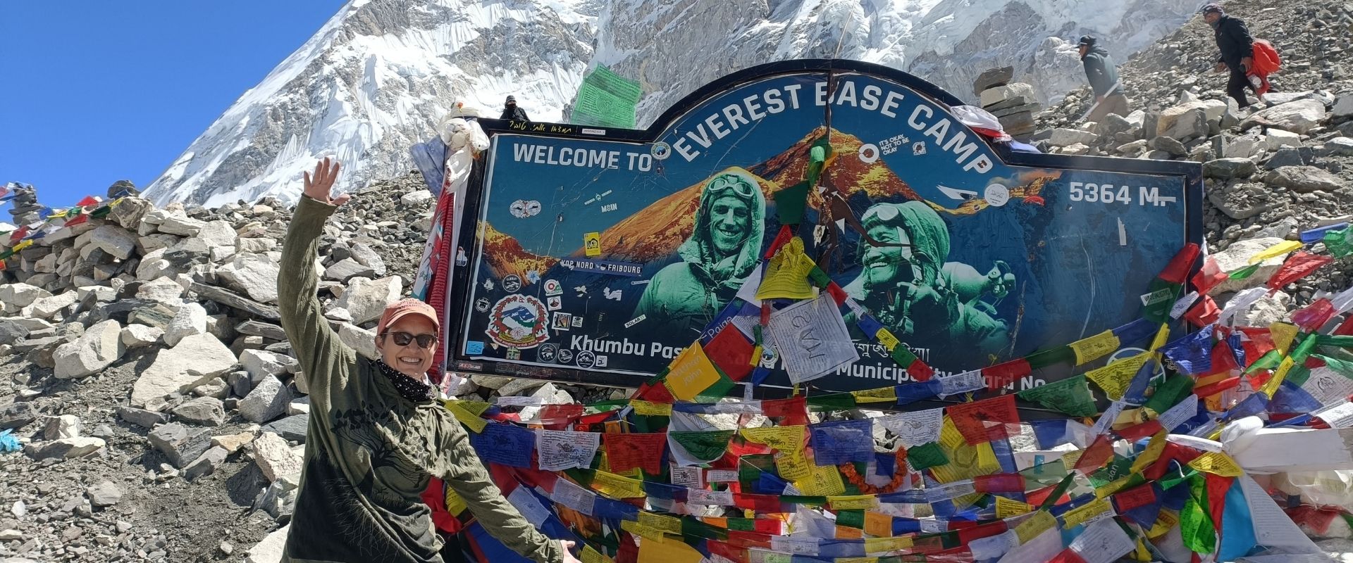 Victory pose at Everest Base Camp marker