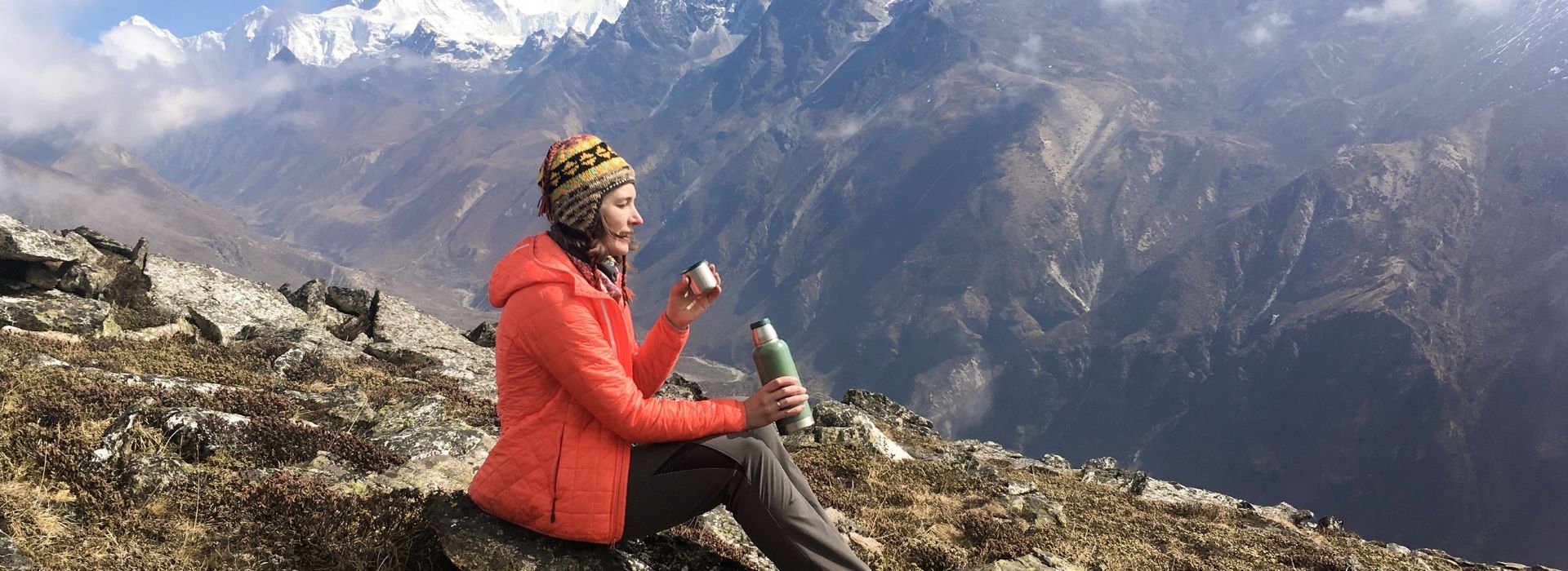 female trekking having altitude medications in nepal trek