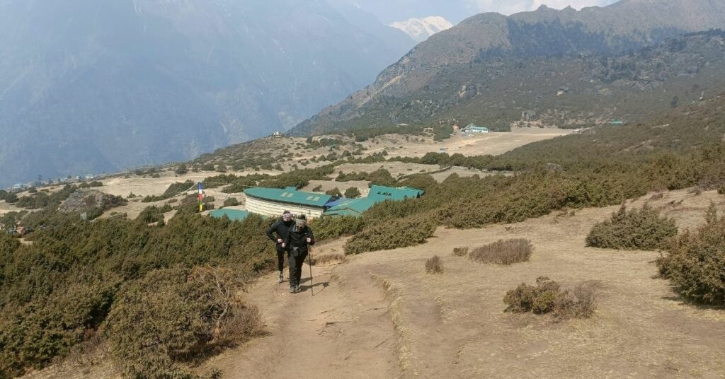 travellers walking towards marpha village