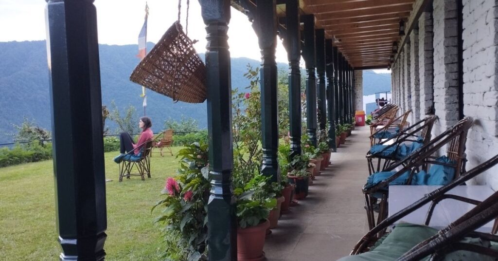 Beginner hiker enjoying sunrise view from Ghorepani Poon Hill with mountain panorama