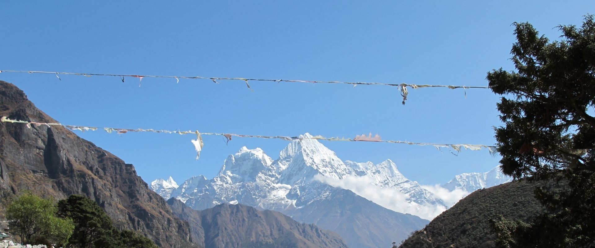 Clear blue sky and white mountains seen from the Everest trek
