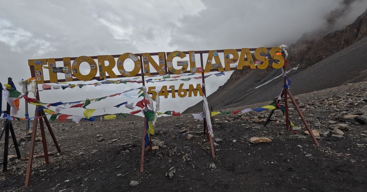 Colorful prayer flags at Thorong La Pass, highest point of Annapurna trek