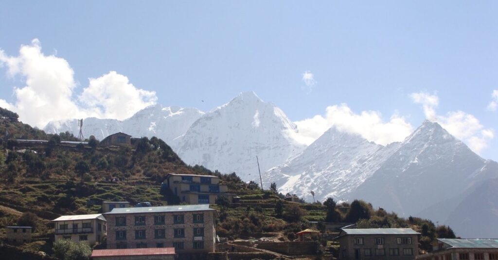 Everest region village with snow-covered mountains in the background