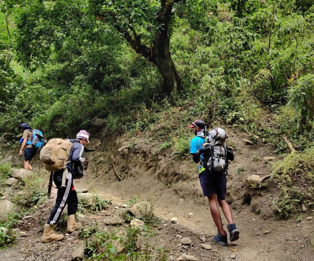 Proper trekking boots and backpacks on rugged Manaslu terrain