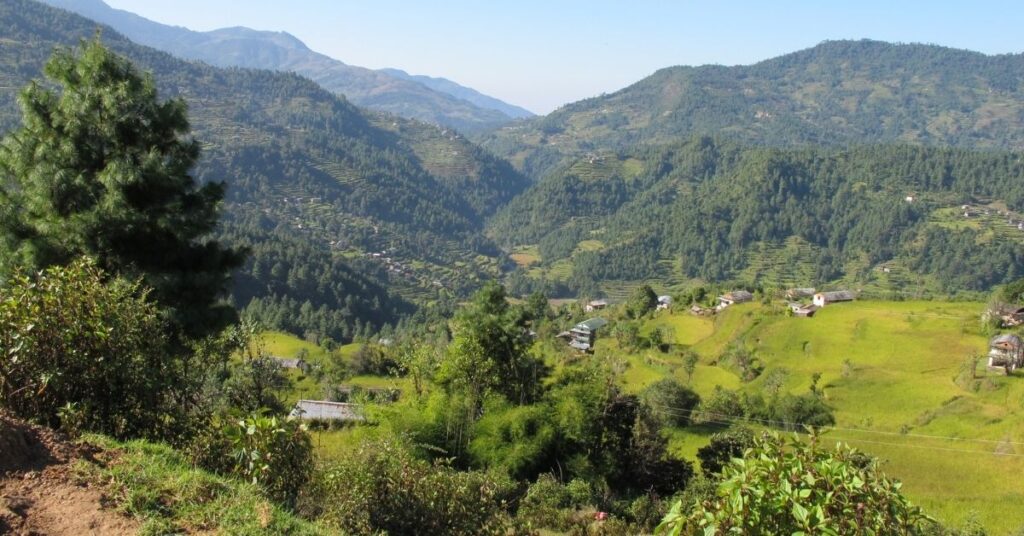 River flowing through green valleys on the Everest Base Camp trek in autumn