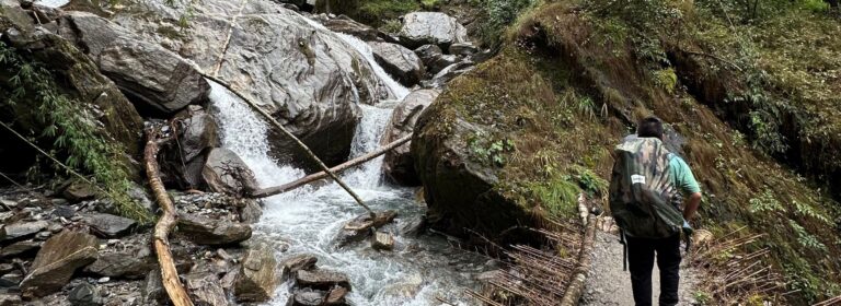 Trail near Machapuchare Base Camp with solo hiker heading toward Annapurna Base Camp