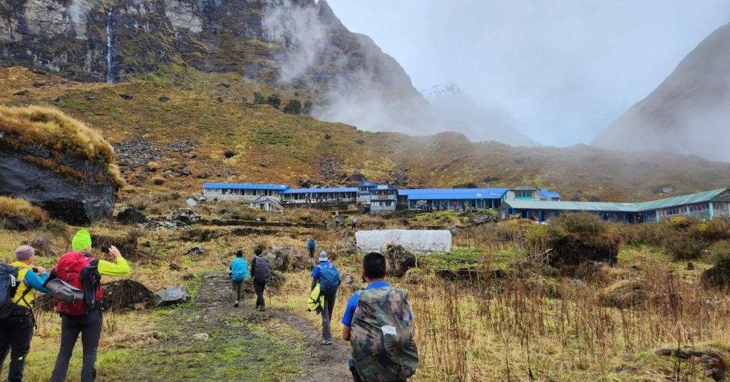 Trekking group approaches tea houses near Annapurna Base Camp