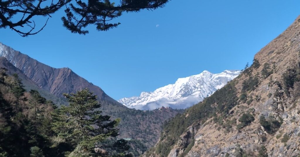 Clear blue skies frame snowy peaks on the Everest region