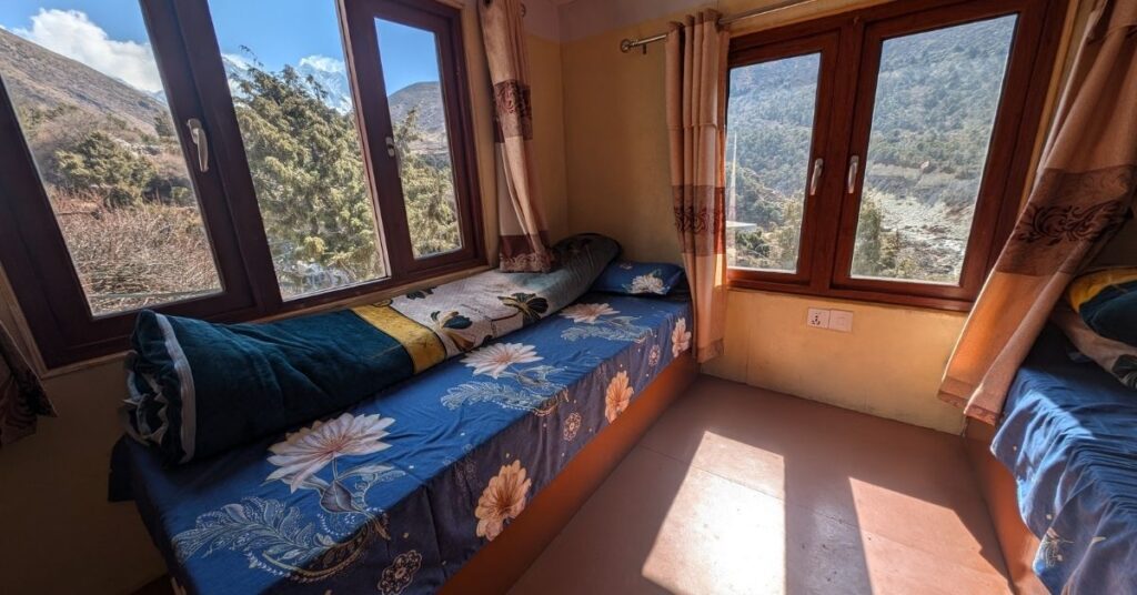 Cozy teahouse room on the Everest Base Camp trek with twin beds