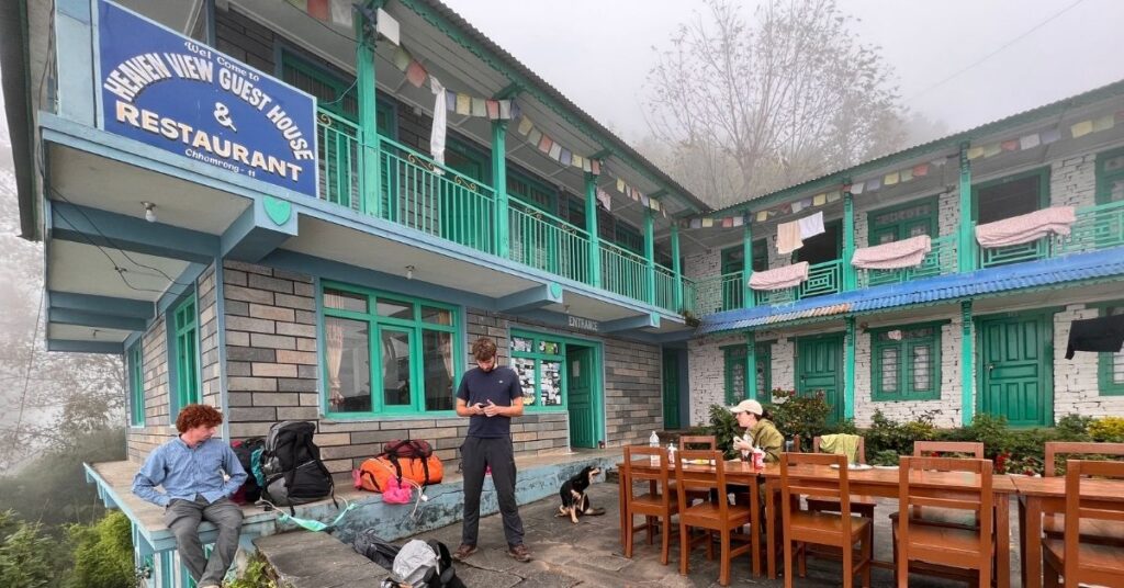 Hotel in Chhomrong village on Annapurna Base Camp trek with green hills and mountain views
