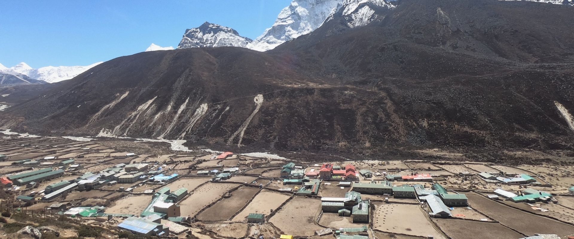 Khumjung Village nestled in the Himalayas, with traditional Nepalese houses