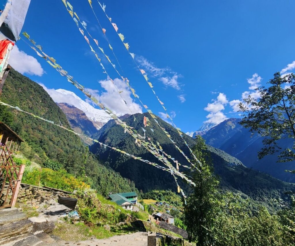 October trekking scene in Annapurna with fluttering prayer flags