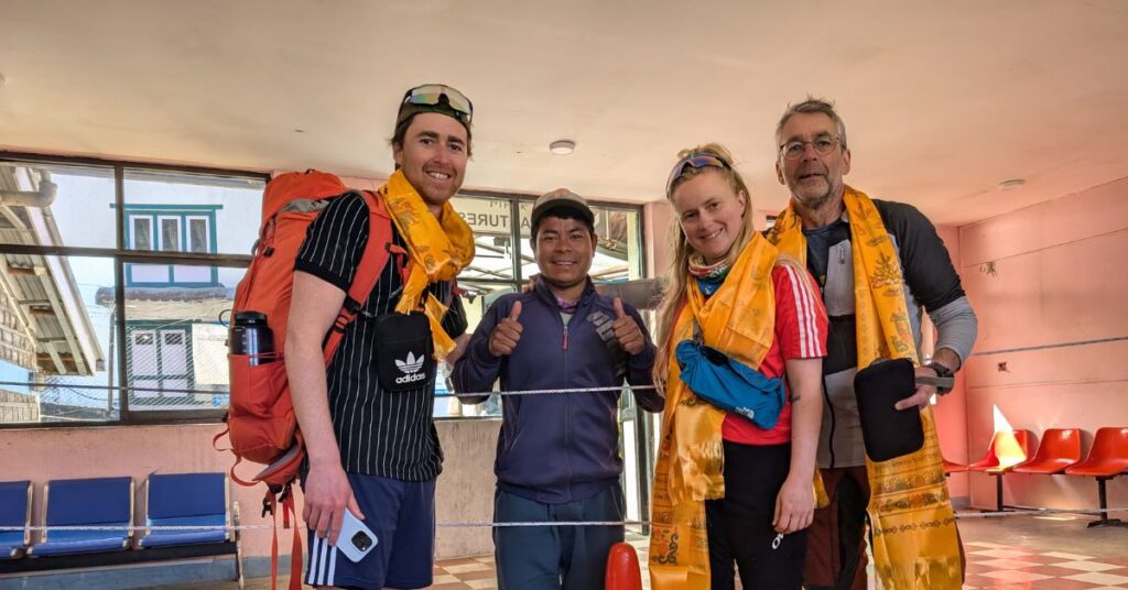 Trekkers ending their Everest Base Camp journey with blessings and smiles