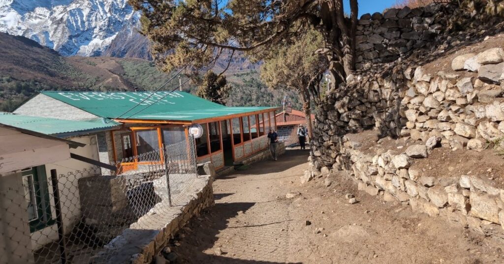 Walkers pass a lodge on the EBC journey on fall