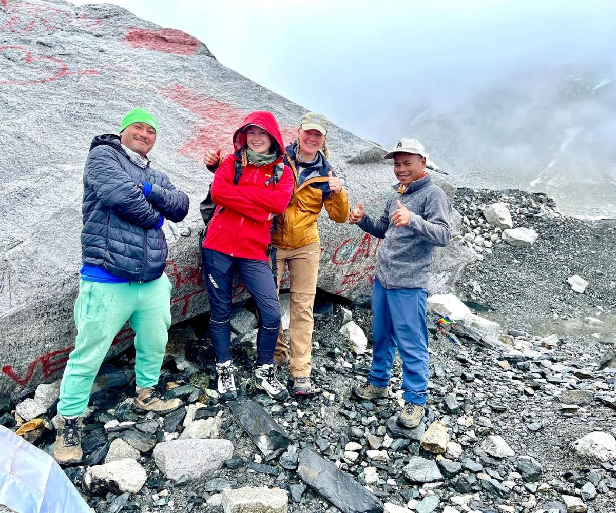 Group of climbers celebrating their arrival at Everest Base Camp