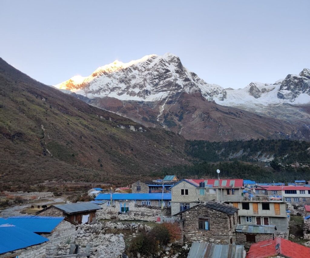 Morning sunlight over Samagaun village rooftops