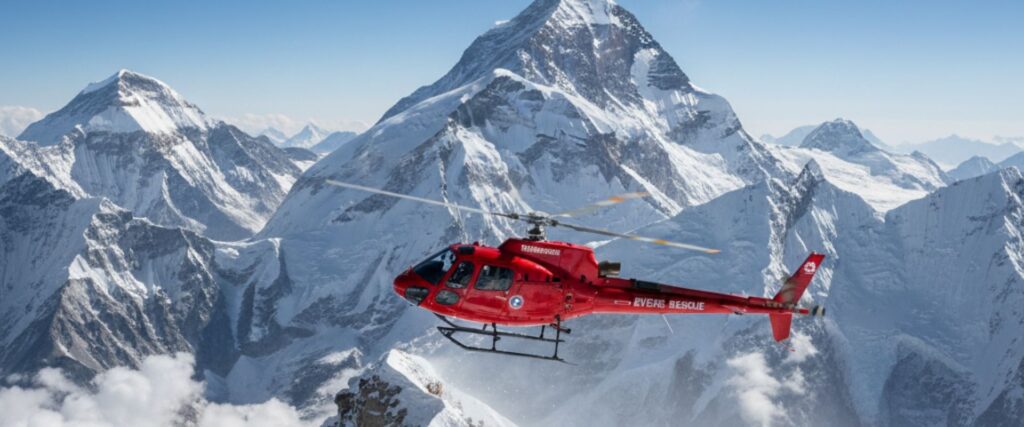 Rescue helicopter hovering to Everest peak