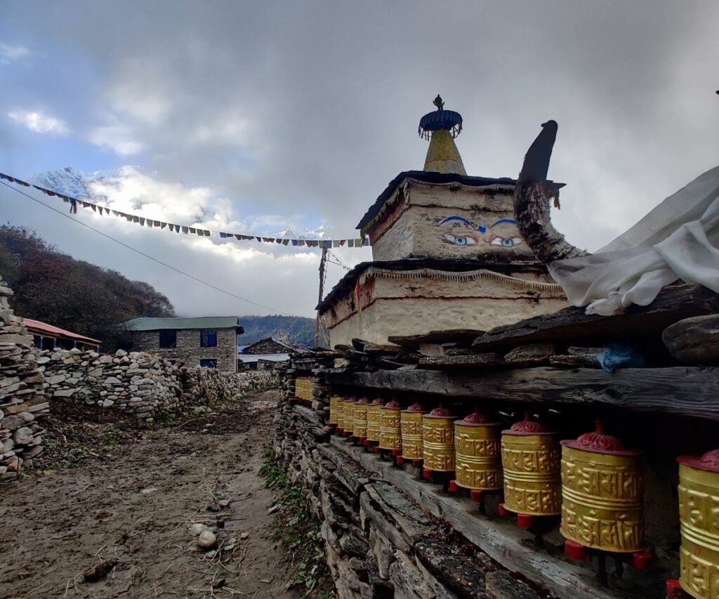 Traditional chorten with Mani wheels in Samagaun