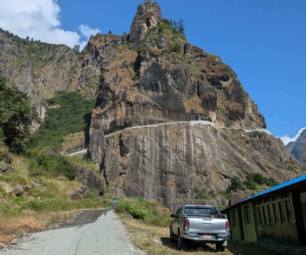 Winding cliff road explored on Nepal trip in jeep