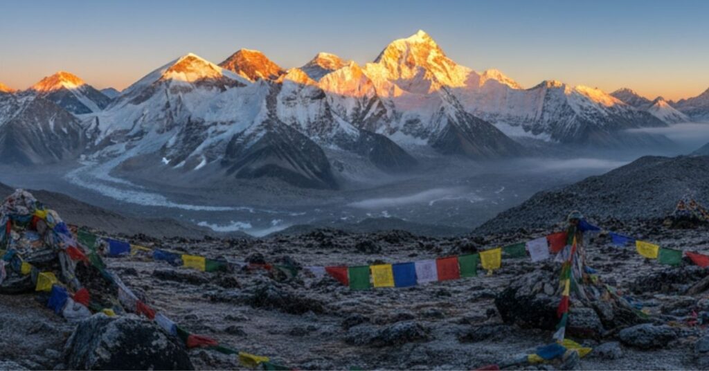 Everest region sunrise with golden light hitting Mt. Everest and icy peaks