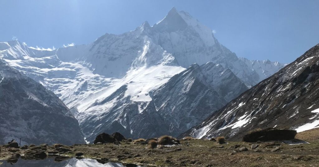 Machapuchare reflected in a still pond near ABC